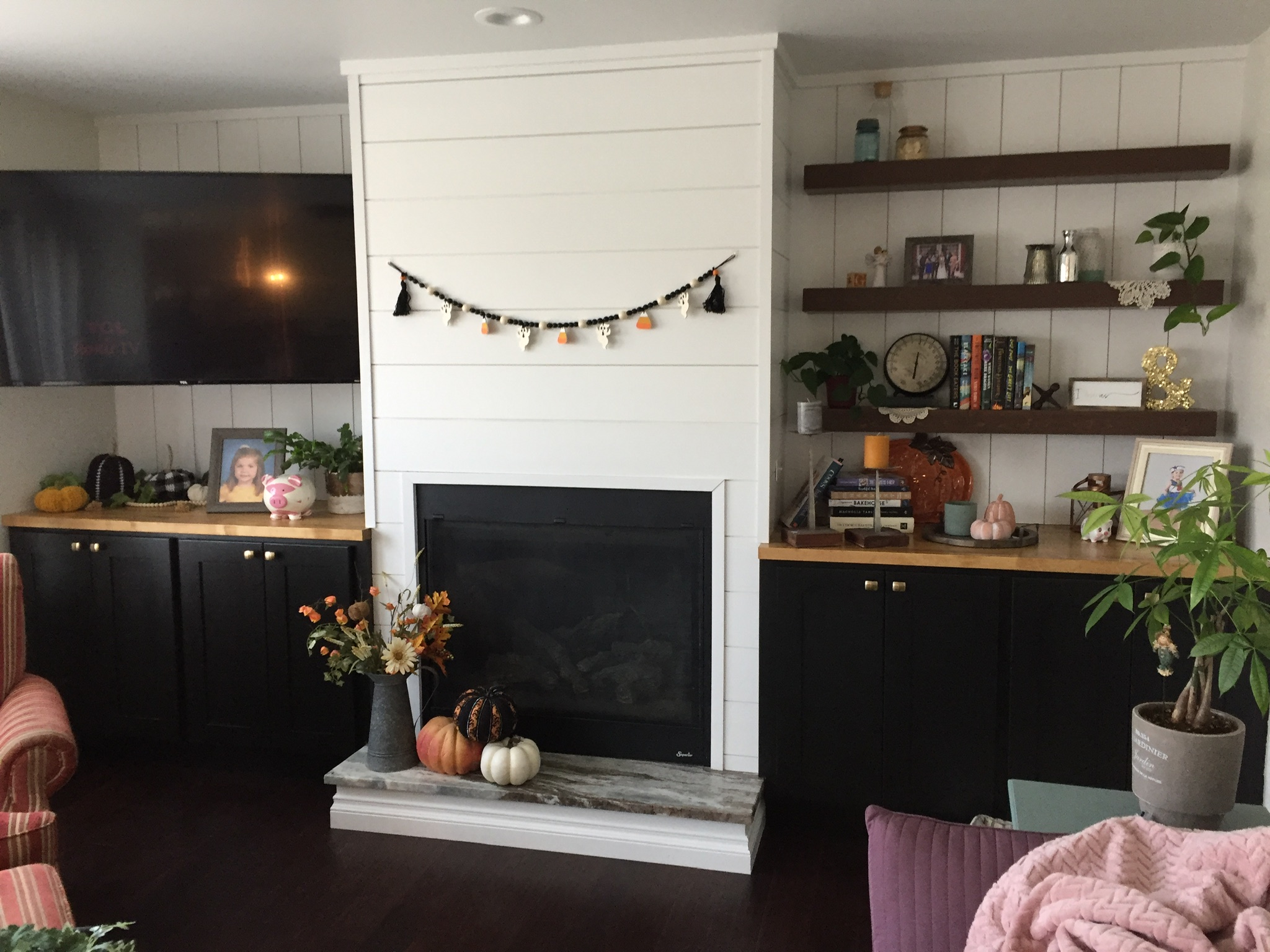 Shiplap fireplace and built-in cabinets